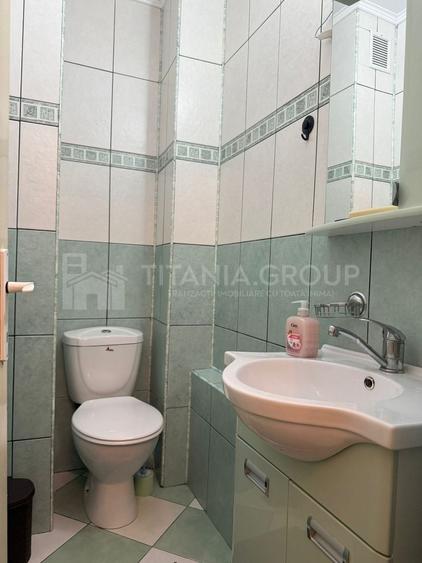 Apartament cu 2 camere, 2 bai, decomandat, etaj 1 - zona Racadau - 9