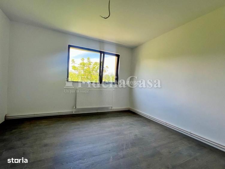 Casa cu 4 camere si 550mp de teren in Voinesti