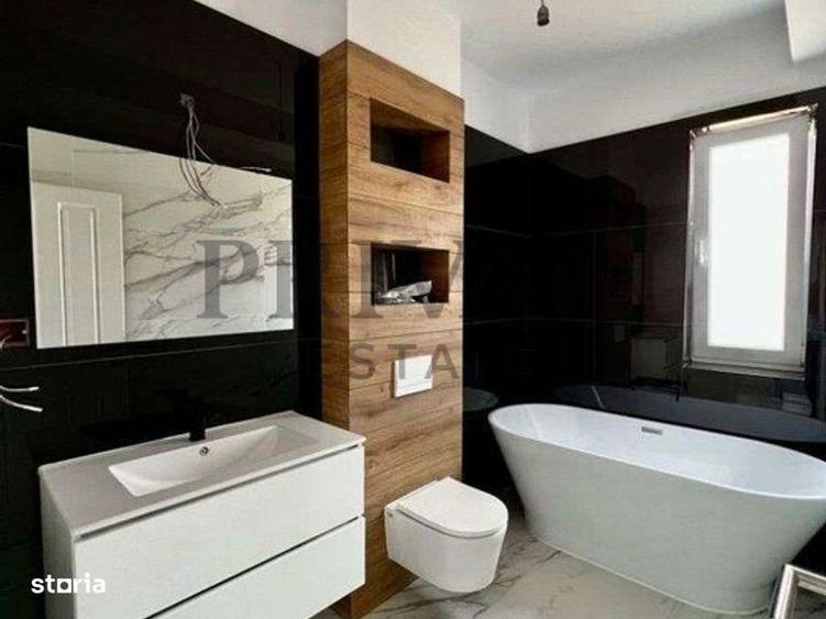 1/2 Duplex 124 mp utili + 330 curte. Dormitor parter,Bucatarie inchisa - 6