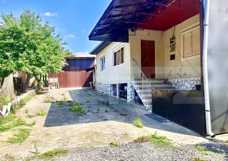 Casa de vanzare cu curte si anexe, teren 1253 mp, Berghin