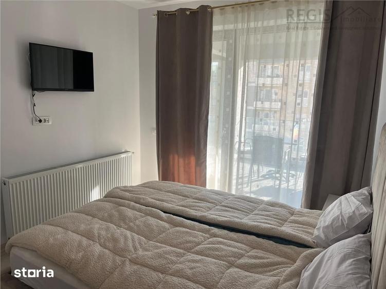 Apartament cu 2 camere semidecomandat, mobilat în Tractorul