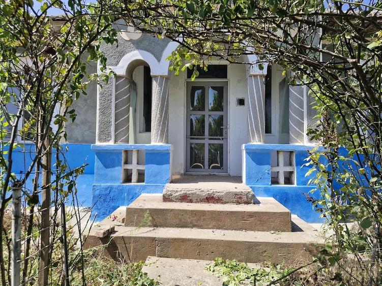 Casă cu Teren 1500 Mp în Tortoman