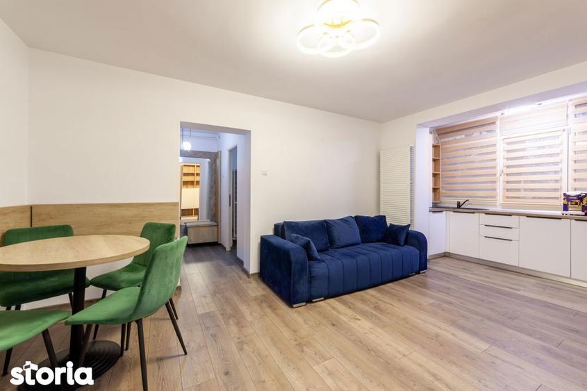 Apartament cu 3 camere semidecomandat, mobilat în Calea București