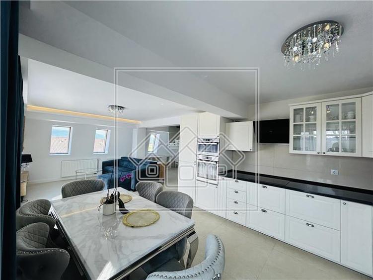 Ap pe 2 niveluri, 75 mp utili + 2 balcoane, mobilat modern - 1