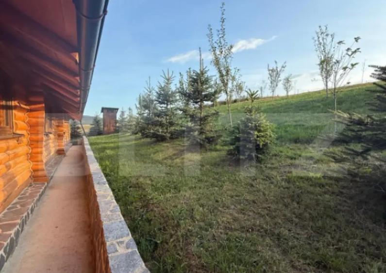 Cabana din lemn rotund, 2 camere, 140 mp, teren 2800 mp, Pal - 16