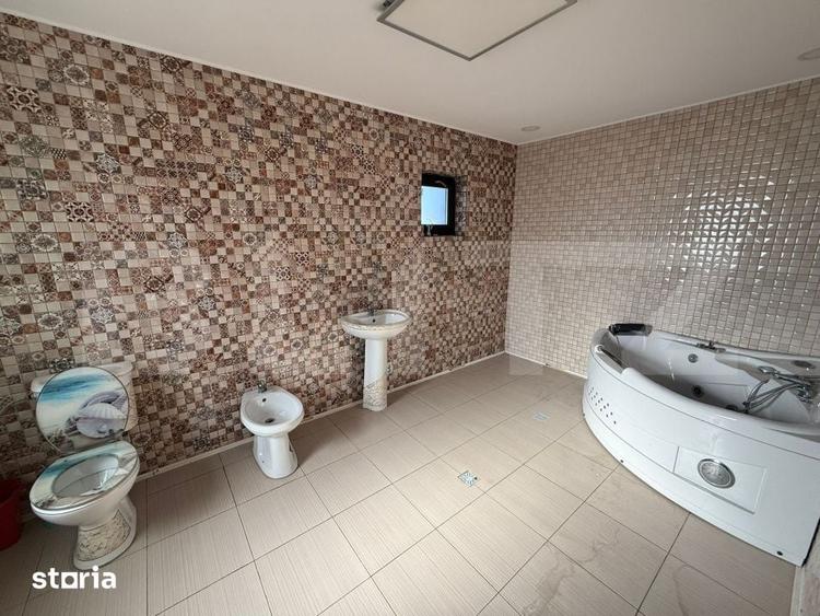 Casă cu 9 camere cu Teren 1000 Mp în Comișani