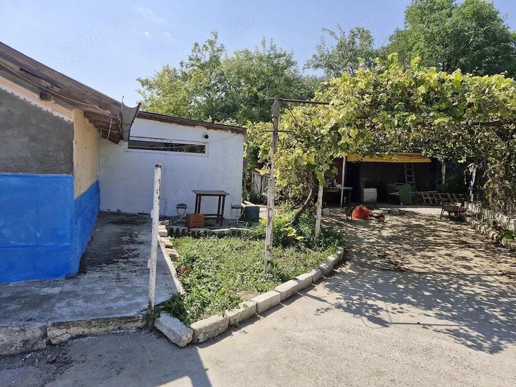 Casă cu Teren 1500 Mp în Tortoman