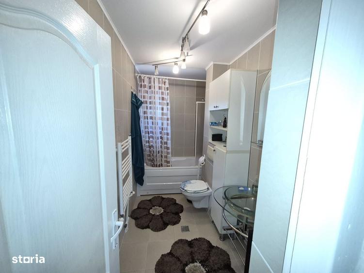 Apartament cu 4 camere decomandat în Bucium