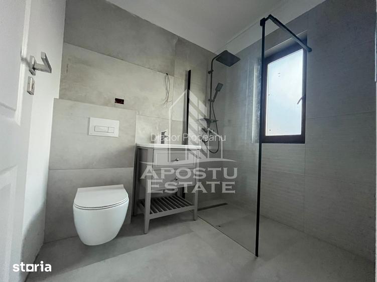 Duplex cu 4 camere, 3 bai,teren 250 mp in zona Dambovita