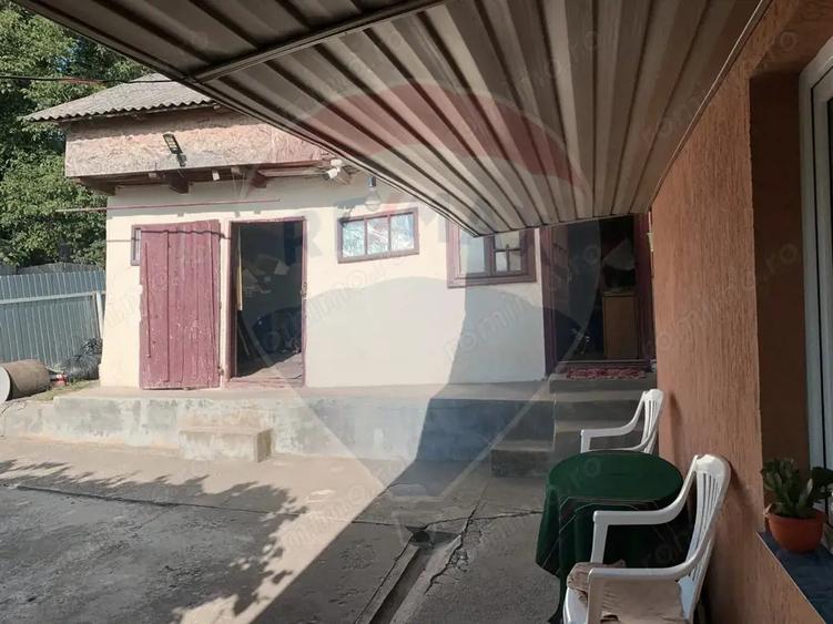 Casă cu Teren 1043 Mp în Dochia