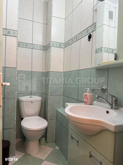 Apartament cu 2 camere, 2 bai, decomandat, etaj 1 - zona Racadau - 10