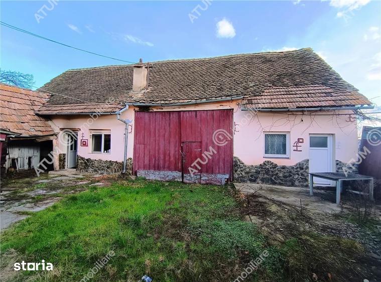 Casă cu 4 camere decomandat cu Teren 1650 Mp în Porumbacu de Jos
