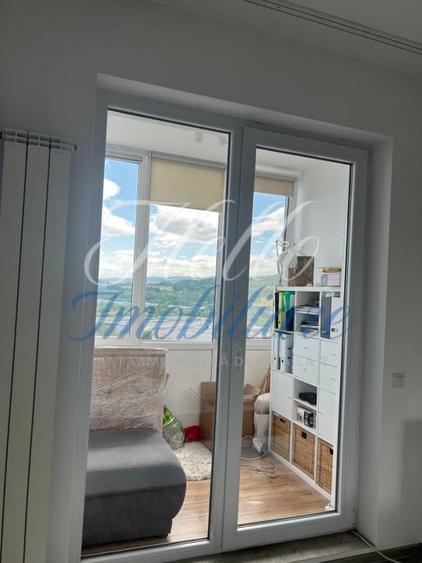 Apartament cu 2 camere semidecomandat, mobilat în Baciu