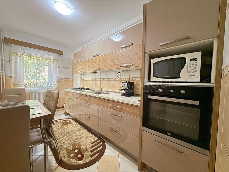 Apartament cu 2 camere, 2 bai, decomandat, etaj 1 - zona Racadau - 3