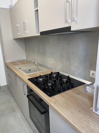 Apartament cu 2 camere decomandat în Tractorul