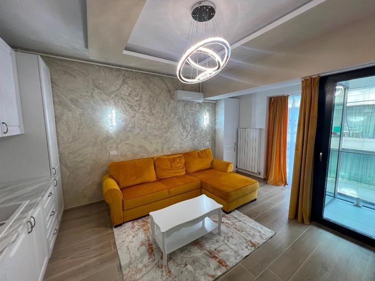 Apartament cu 2 camere semidecomandat, mobilat în Central