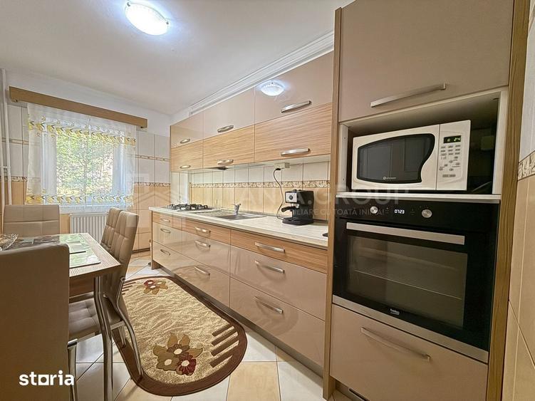 Apartament cu 2 camere, 2 bai, decomandat, etaj 1 - zona Racadau - 3