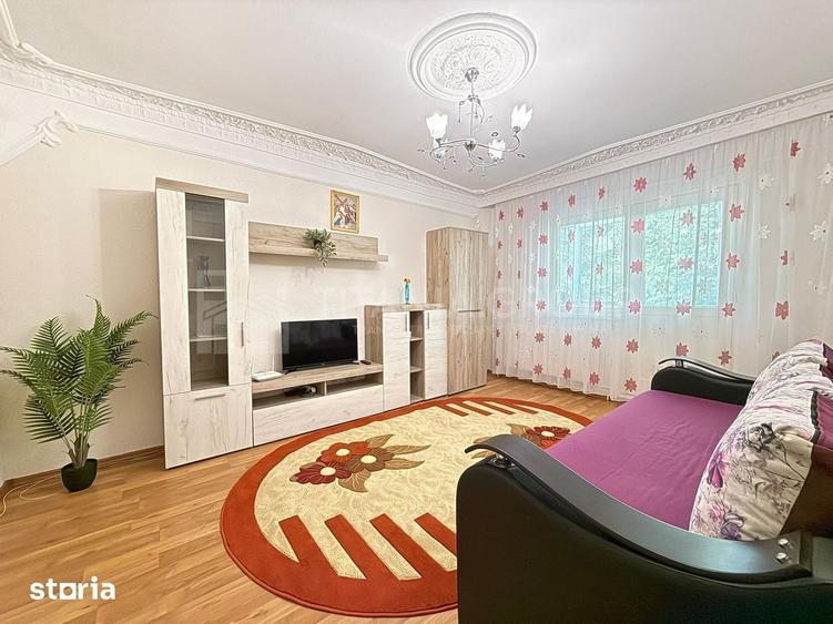 Apartament cu 2 camere, 2 bai, decomandat, etaj 1 - zona Racadau - 1