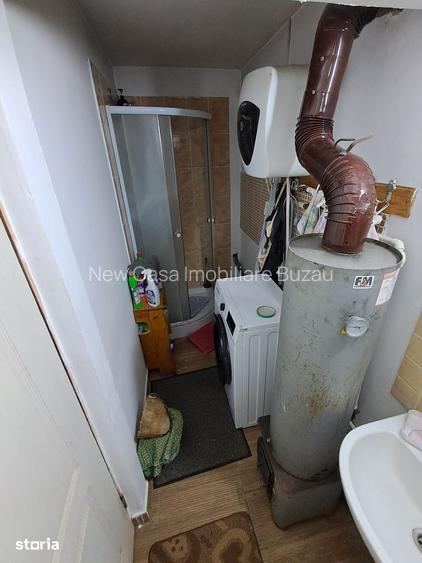 Casa cu 2 camere, teren 1000 mp, acces asfaltat