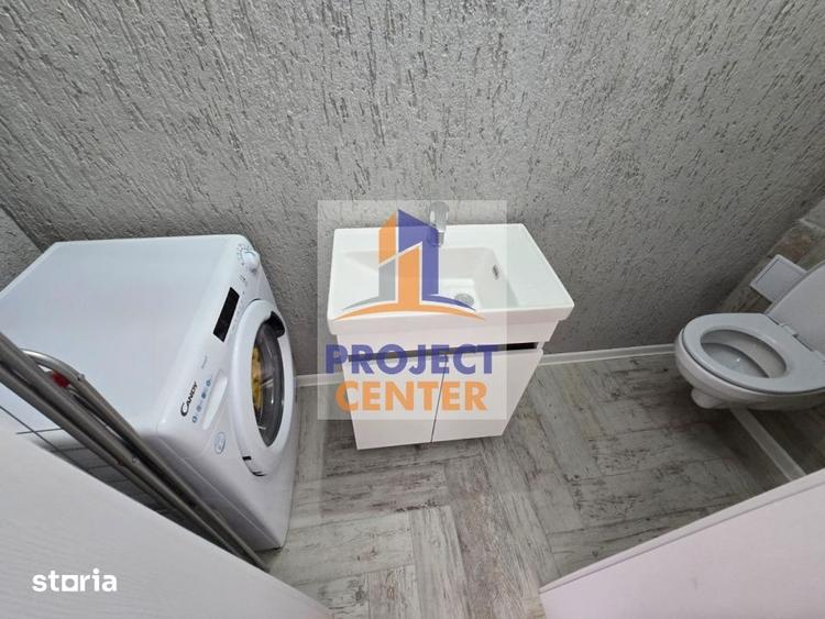 Apartament cu 3 camere semidecomandat în Calea București