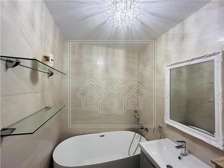 Ap pe 2 niveluri, 75 mp utili + 2 balcoane, mobilat modern - 18