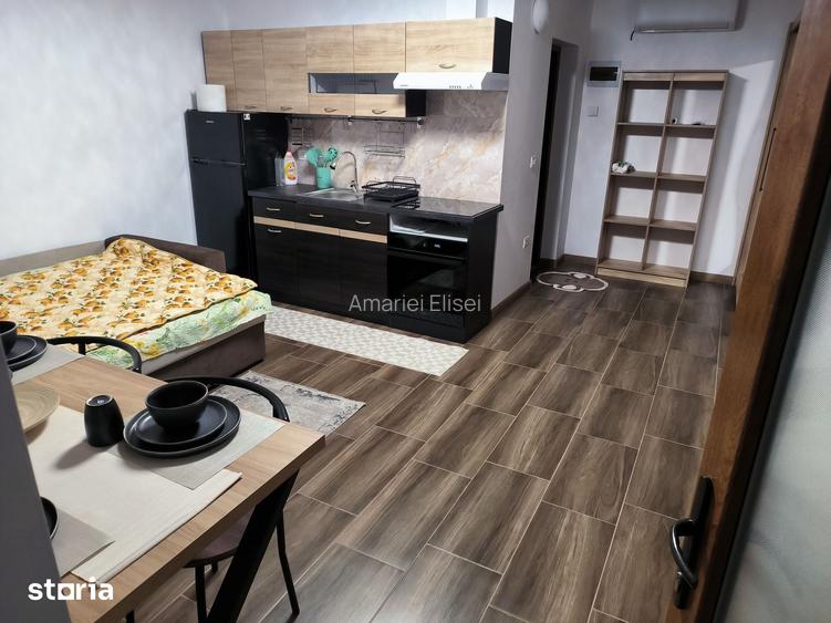 Garsoniera de inchiriat, cu gradina, parcare ?i terasa