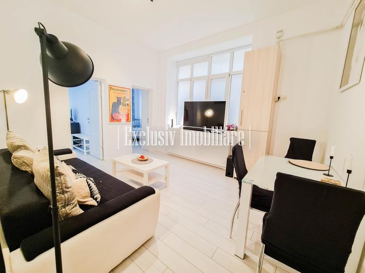 Apartament cu 3 camere semidecomandat, mobilat în Central