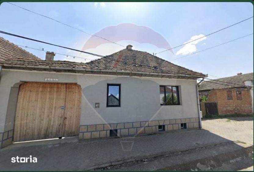 Casă cu 4 camere cu Teren 1346 Mp în Comana