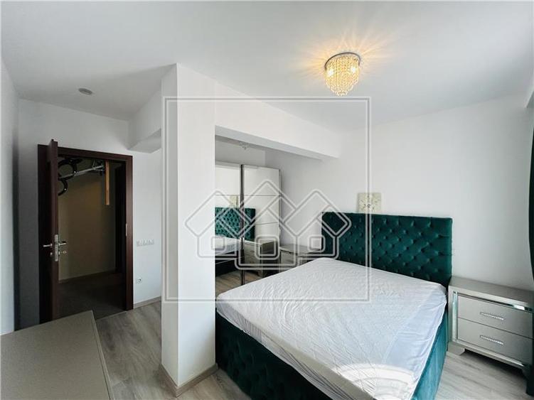 Ap pe 2 niveluri, 75 mp utili + 2 balcoane, mobilat modern - 16