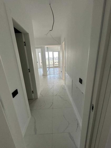 Apartament cu 3 camere decomandat în Cățelu