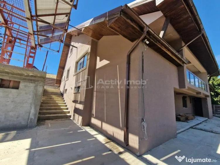 Casă cu 12 camere cu Teren 1000 Mp în Români