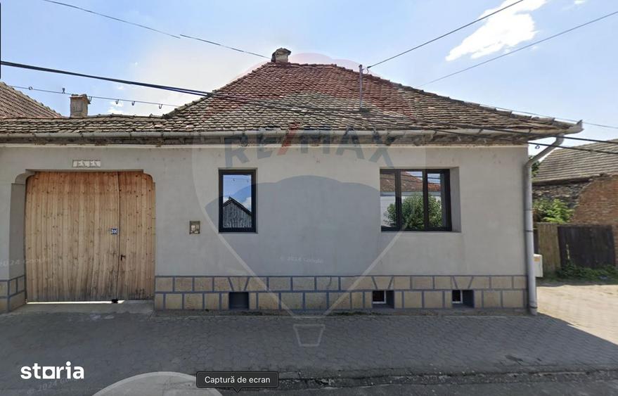 Casă cu 4 camere cu Teren 1346 Mp în Comana