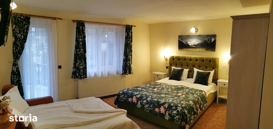 Casă cu 10 camere cu Teren 1292 Mp în Moieciu