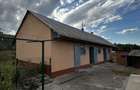 Casa-Gospodarie-locuibila cu 3 cam+ 2 anexe +1700mp teren in sat Manastireni la 15km de BT!