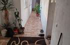 Casa de vanzare cu doua camere baie si bucatarie spait .