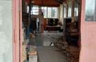 Teren intravilan + locuinta+atelier-3 soproane metalice in Hodis, jud - 8