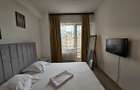 Apartament de vanzare in Summerland vedere laterala catre ac si mare - 2