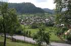 Rucar, teren intravilan 3214 mp cu deschidere 56 m in DN73 - 3