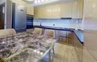 Apartament cu 4 camere decomandat în Tractorul - 2