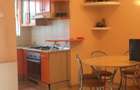 Inchiriez un apartament central. cu 2 , camere , living, curte - 1