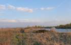 Vand 9 ha teren agricol cu 1,4 ha luciu apa