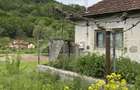 Vand casa ?i teren in Munteni, comuna Bulz, cu ie?ire la DJ - 1