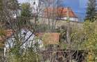Casa taraneasca in centrul localitatii Ilieni teren 832 mp. - 1