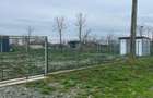 Teren intravilan de vanzare 2200m2cu hala metalica inchisa de 450m2