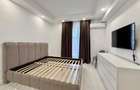 COSMOPOLIS - Apartament cu 3 camere si gradina, mobilat si utilat.