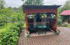 Casa de lemn cu teren generos 1500 mp in Cerghid, liniste si natur