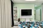 COSMOPOLIS - Apartament cu 3 camere si gradina, mobilat si utilat.