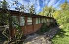 Cabana de lemn cu fundatie 86 mp+ livada pomi fructiferi+teren 847 mp