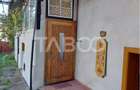 Casa de vanzare cu 2 apartamente separate si teren 544 mp Cisnadioara - 1