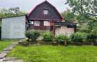 Casa de lemn cu teren generos 1500 mp in Cerghid, liniste si natur